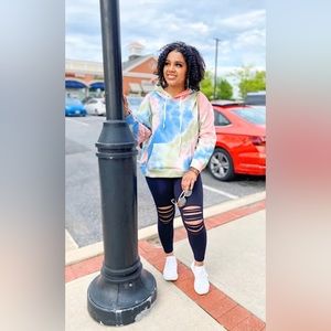 Chic vintage look tie-dye hoodie sweatshirt. Comfy fit with swirling hues.